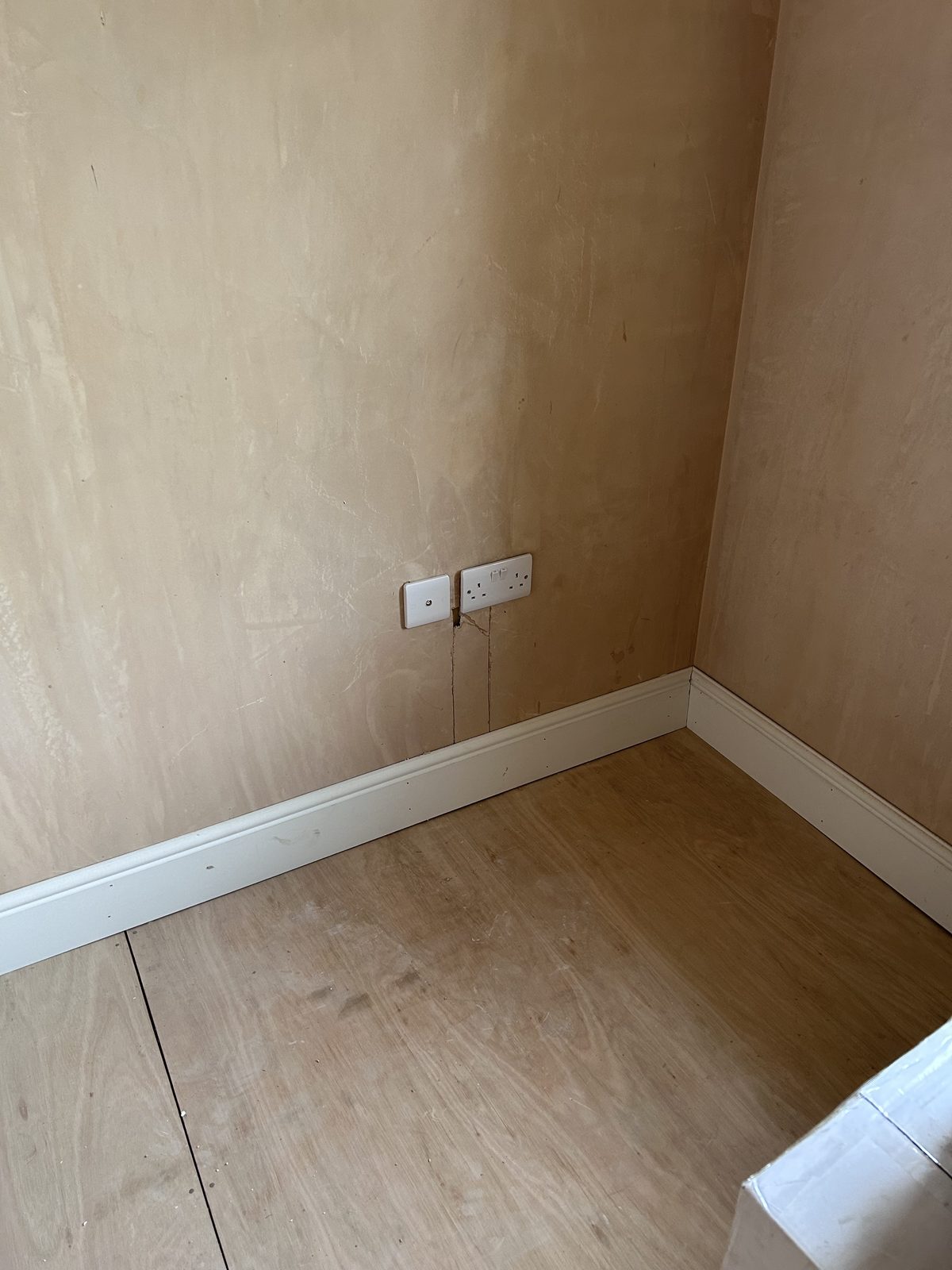 Data and power points installed on a plastered wall before decoration, Leith property development